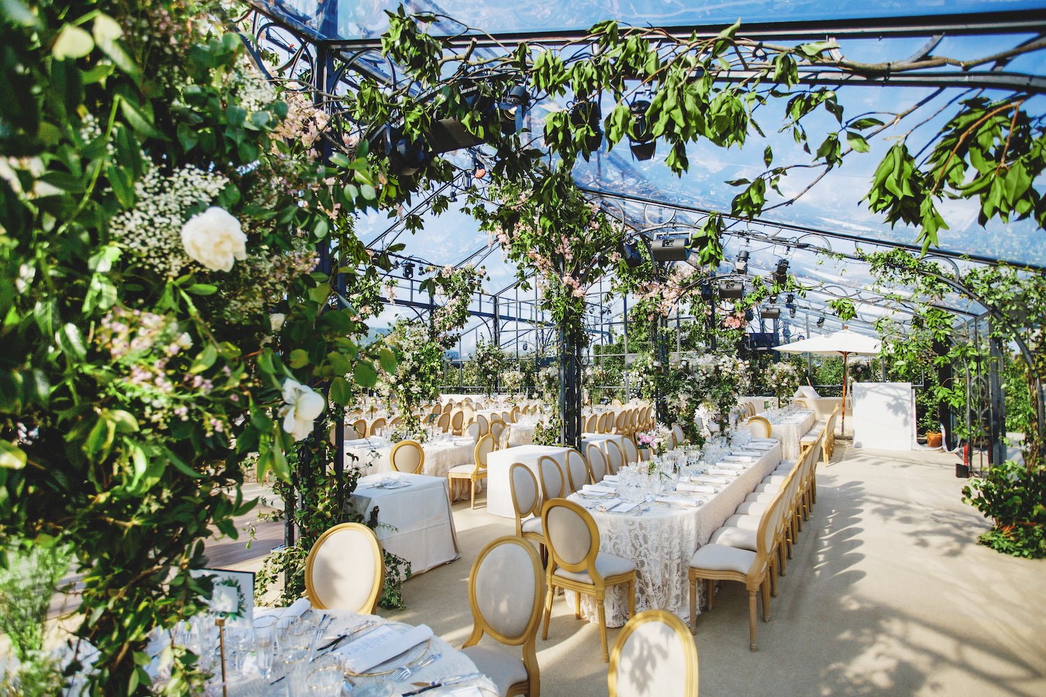glass marquee with climbing florals at french destination wedding 