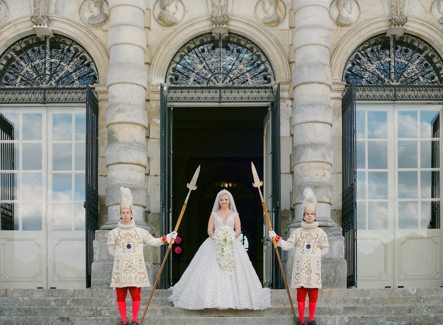 bride with royal guards at Château de Vaux-le-Vicomte