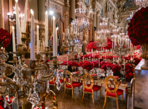 Red monochromatic floral installation inside Opéra Garnier
